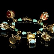 Yellow gold bracelet with pendants and coloured stones