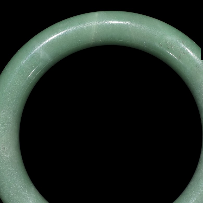 Carved green jadeite bangle, 20th century