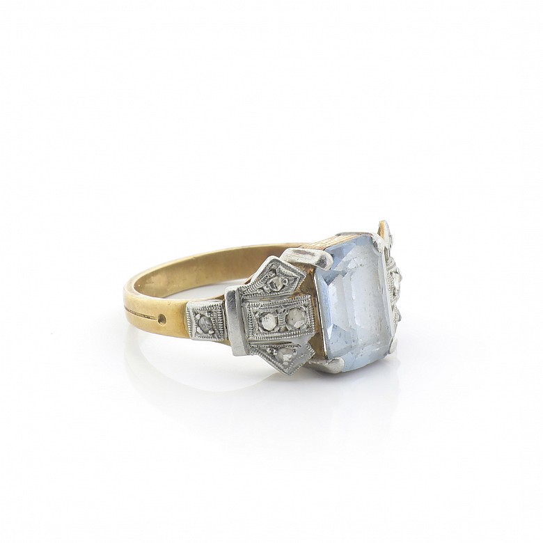 18k Gold ring with diamonds and a blue stone