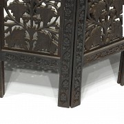 Carved wood table with a base, 20th century