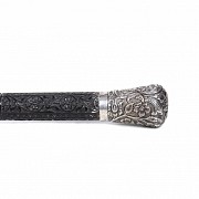 Ebony staff with silver handle.