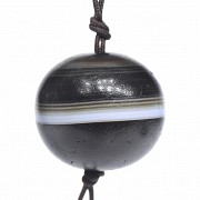 Spherical 'Yàoshī zhū' agate bead, Tang dynasty