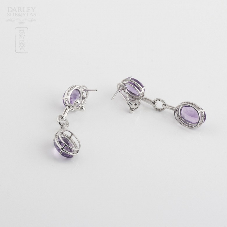 Long earrings with amethysts and diamonds.