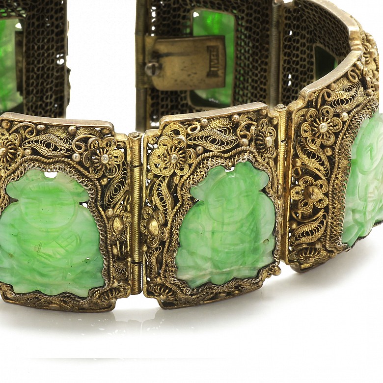 A Silver bracelet with jade plaques.