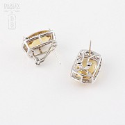 Earrings in 18k white gold with citrines and diamonds.