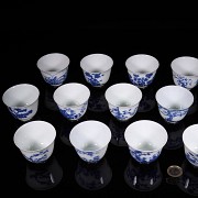 Set of twelve blue and white porcelain mugs, 20th century