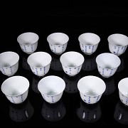 Set of twelve blue and white porcelain mugs, 20th century