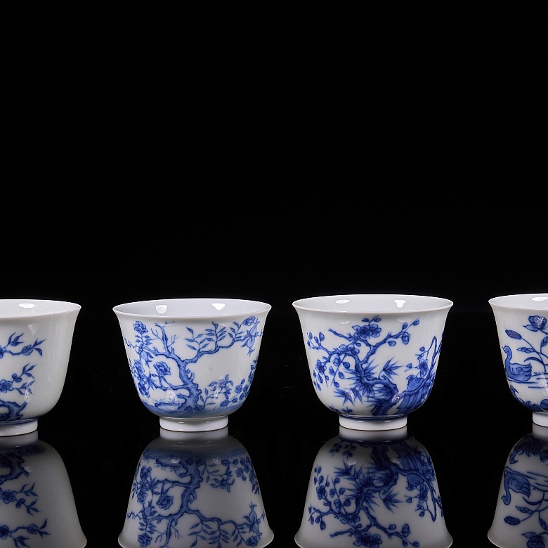 Set of twelve blue and white porcelain mugs, 20th century