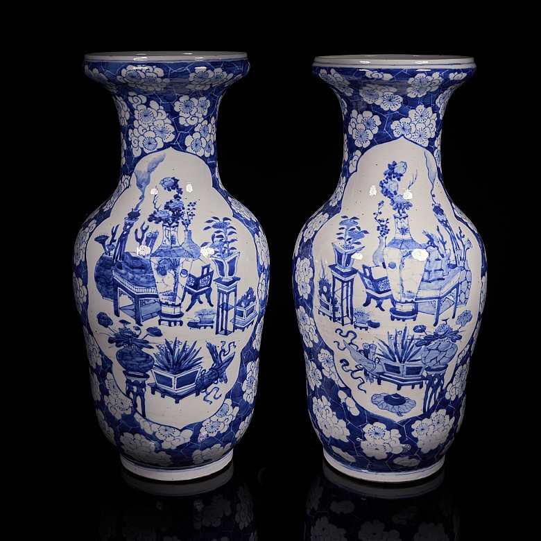 Pair of blue and white ‘Scenes and Plum Blossom’ vases, Qing Dynasty