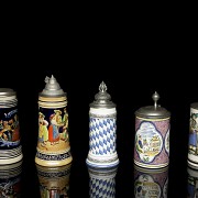 Five glazed ceramic beer steins, 20th century