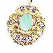 14k yellow gold medallion, blue agate, amethysts, sapphires, pearls and gems.