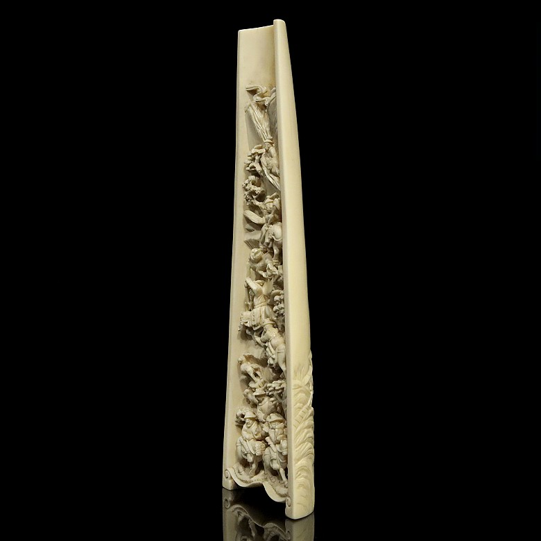 A carved ivory wrist rest, 19th century