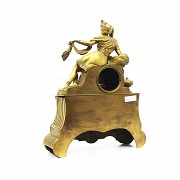 Table clock in gilt bronze, France, mid-19th century.