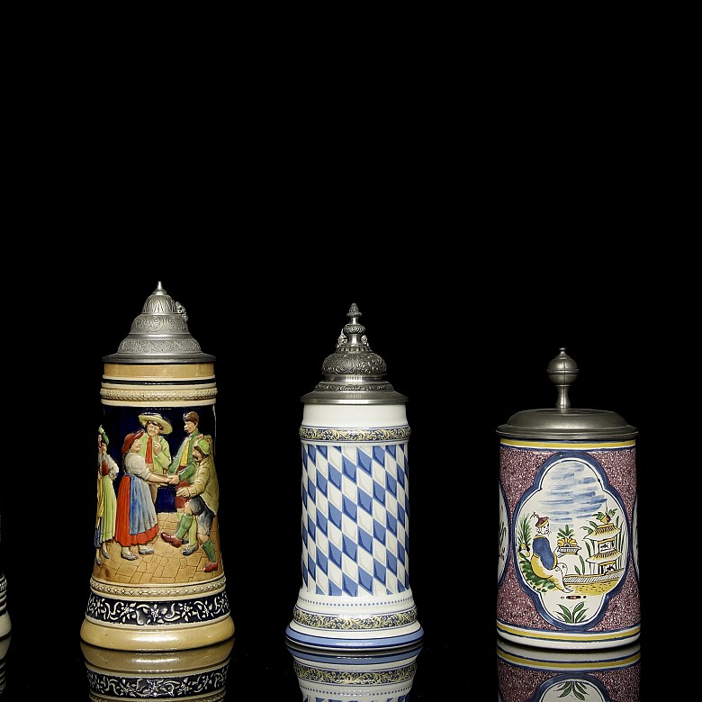 Five glazed ceramic beer steins, 20th century