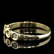 Anillo de oro amarillo 18 k con cuatro brillantes