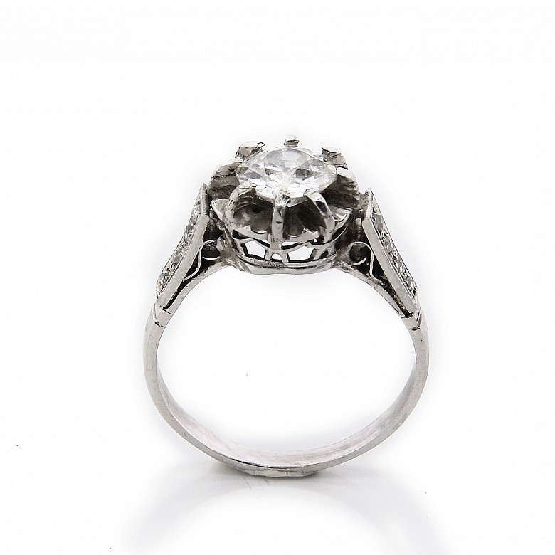 18k white gold solitaire ring with diamonds.