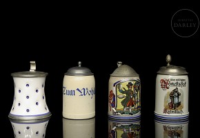 Four earthenware beer steins, 20th century