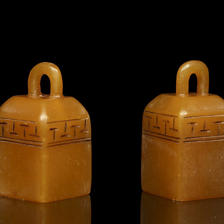 Pair of stone stamps, 20th Century