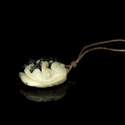 Asian pendant and book, 20th century