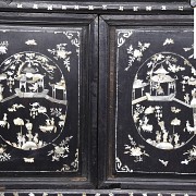 A Chinese lacquered cabinet with mother-of-pearl inlays, Qing dynasty.