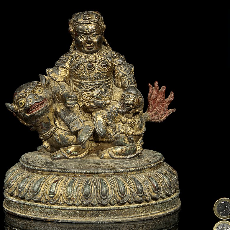 Sculpture of Buddha on lion.