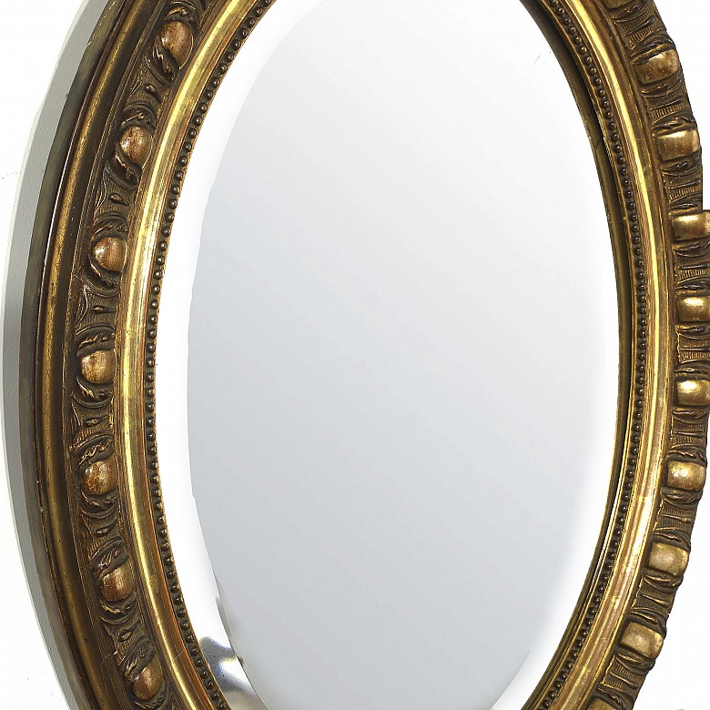 Carved and gilded wooden mirror, 20th century