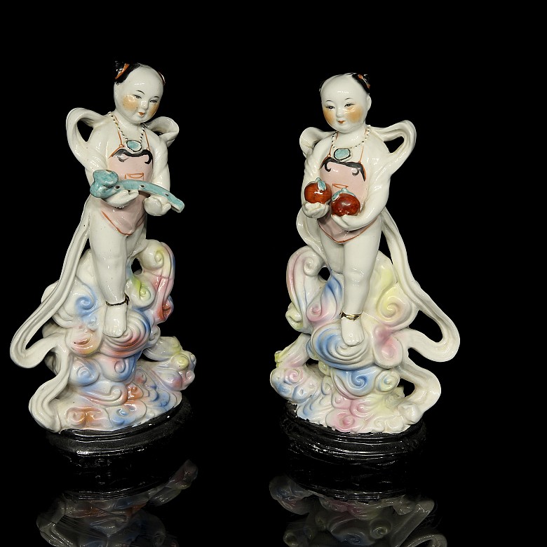 Pair of porcelain children, 20th century