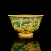 Porcelain enamelled bowl with yellow background ‘Dragon’, with Qianlong seal