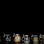 Six glazed ceramic beer steins, 20th century