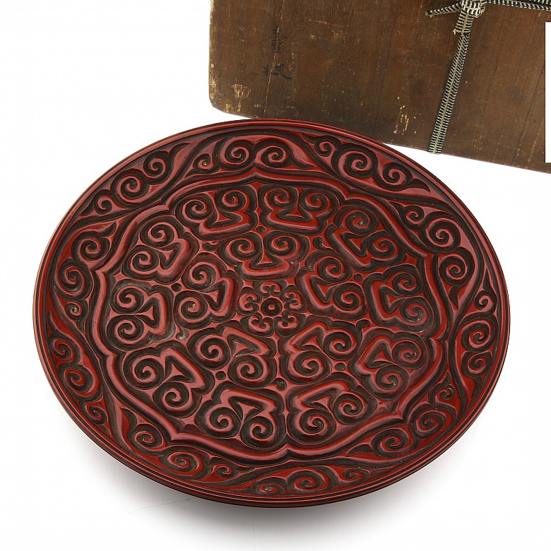 A large carved cinnabar lacquer dish, China, Qing Dynasty.