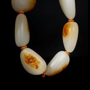 Eight-bead carved white jade bracelet, 20th century