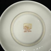 Three plates and a small jar of Asian porcelain “ famille rose”, 20th century