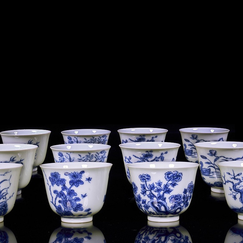 Set of twelve blue and white porcelain mugs, 20th century