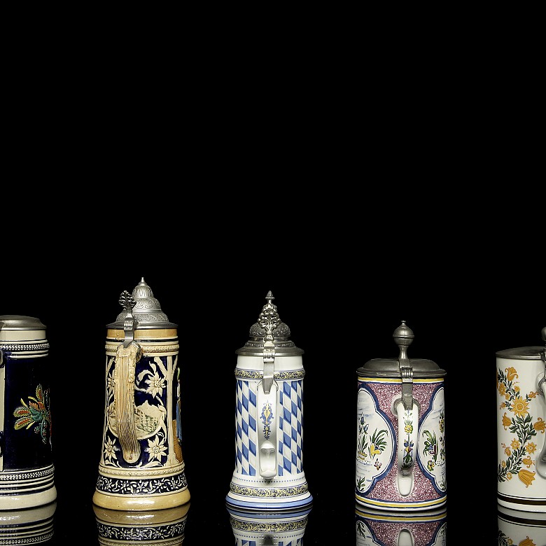 Five glazed ceramic beer steins, 20th century