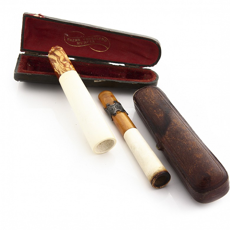 Two mouthpieces in meerschaum, amber and silver, 19th century