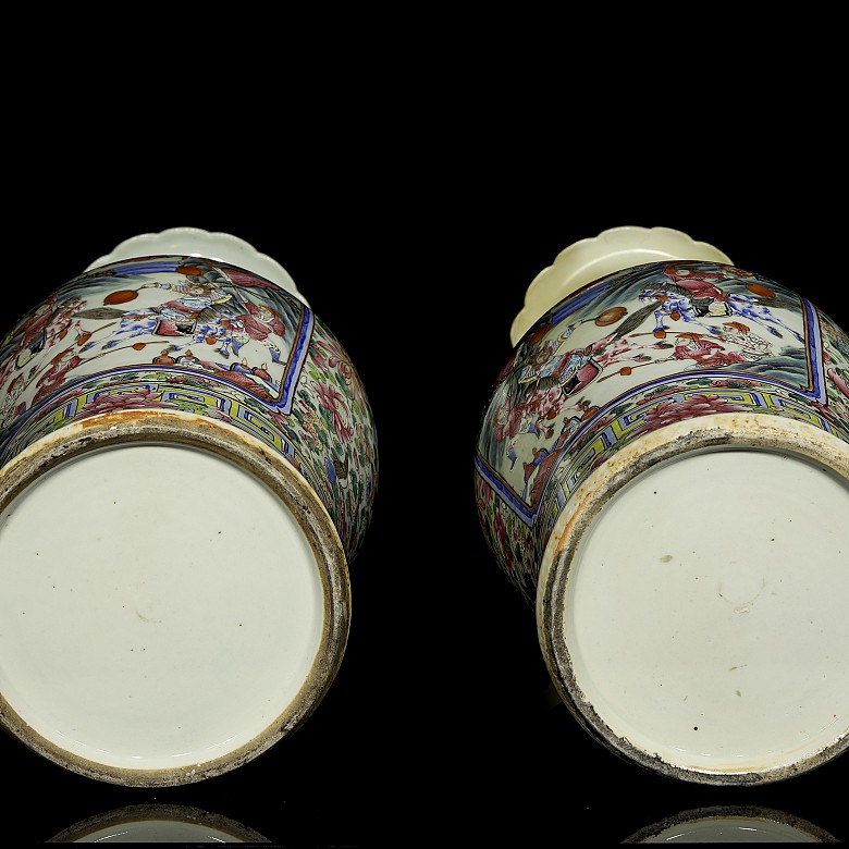 Pair of enamelled vases famille rose “Palace scenes”, Qing dynasty