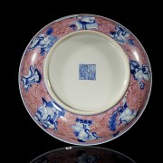 Porcelain plate in red, blue and white ‘The Eight Immortals’, with Qianlong trademark