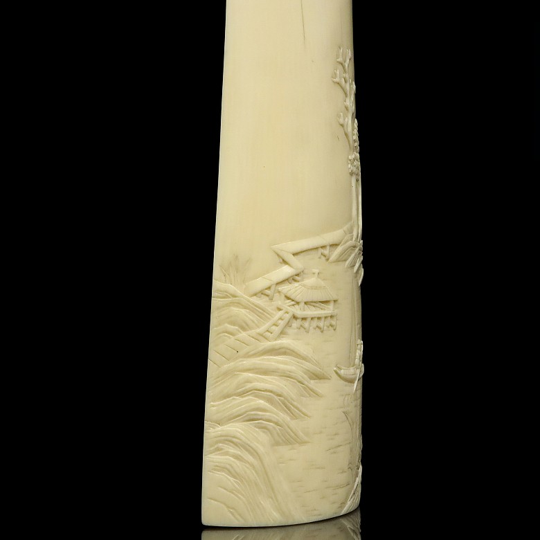 A carved ivory wrist rest, 19th century