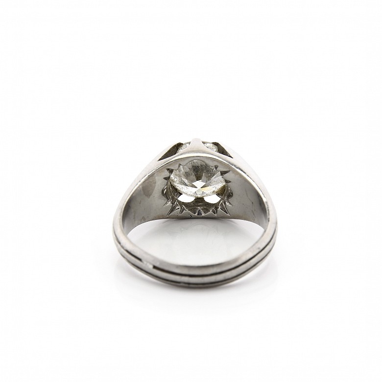 18k white gold solitaire ring with a diamond.