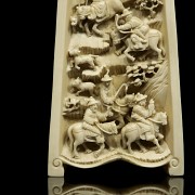 A carved ivory wrist rest, 19th century