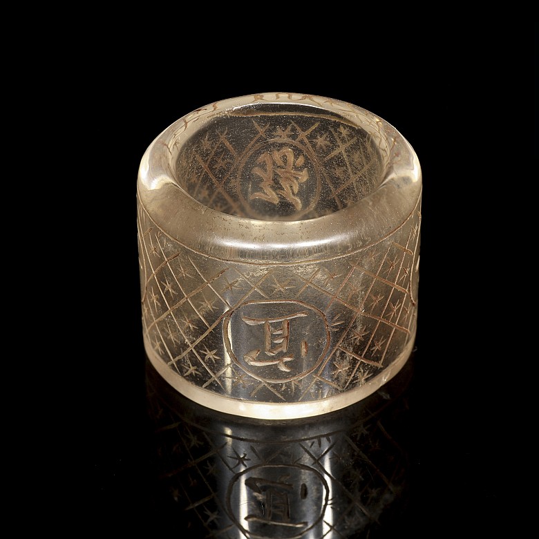 Carved quartz ring with characters, 20th century