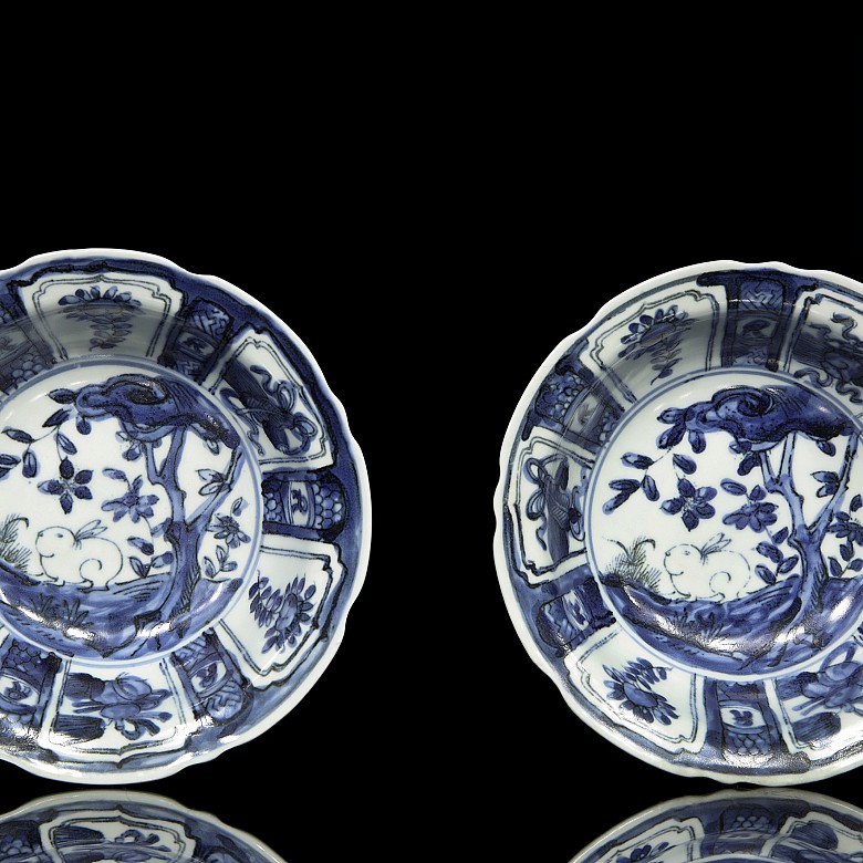 Pair of plates, blue and white, with landscapes, 20th century