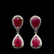 Earrings with movement in white gold with rubies and diamonds