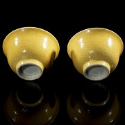 Pair of yellow-glazed porcelain cups, Qing dynasty