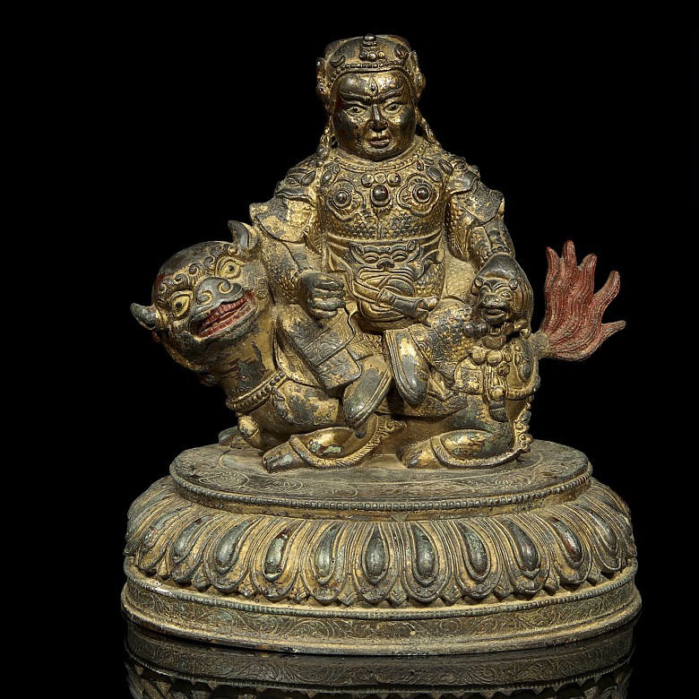 Sculpture of Buddha on lion.