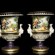 Pair of porcelain enamelled urns ‘Lovers’, 20th century