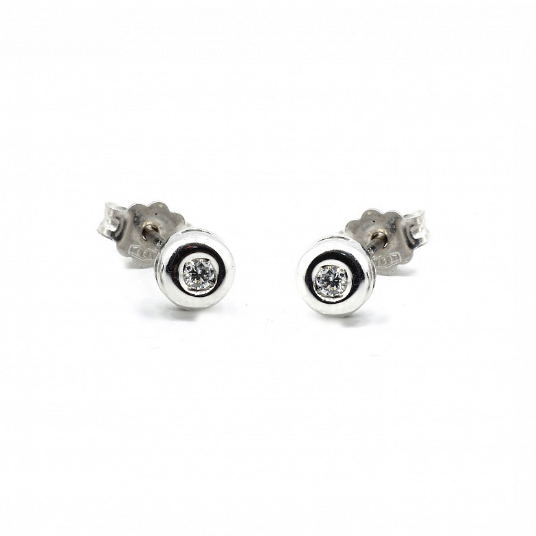 Earrings, sleeper type, in 18k white gold and diamonds.