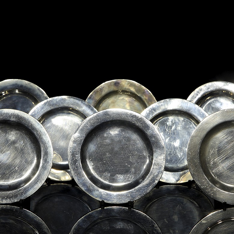 Twelve small silver plates collection