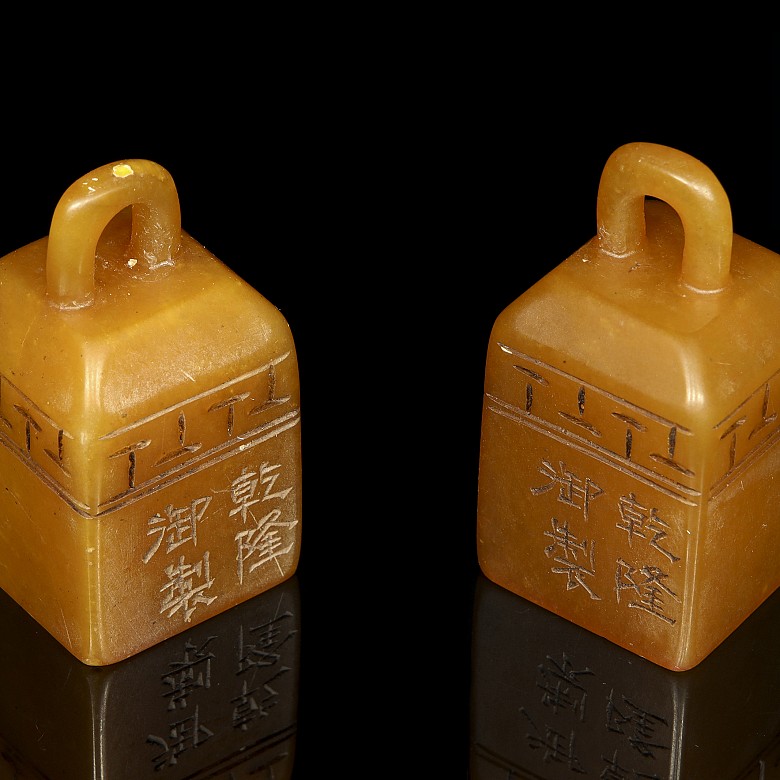 Pair of stone stamps, 20th Century