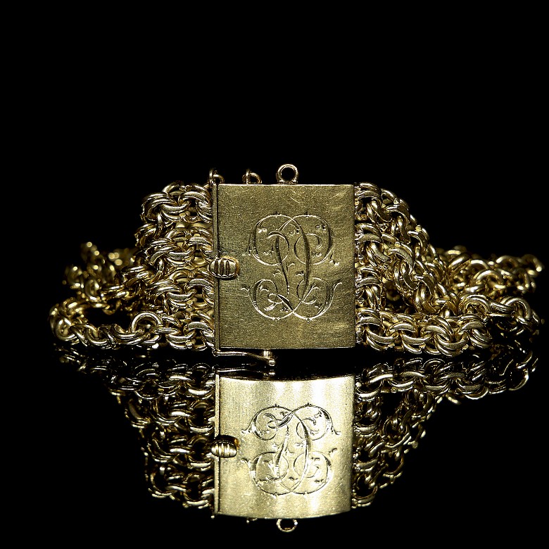 Bracelet with four chains in yellow gold